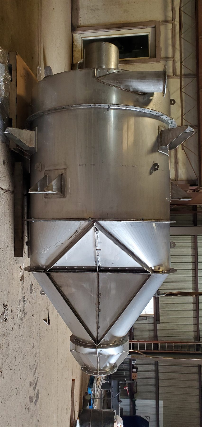 Fabricated hopper vessel in a steel shop
